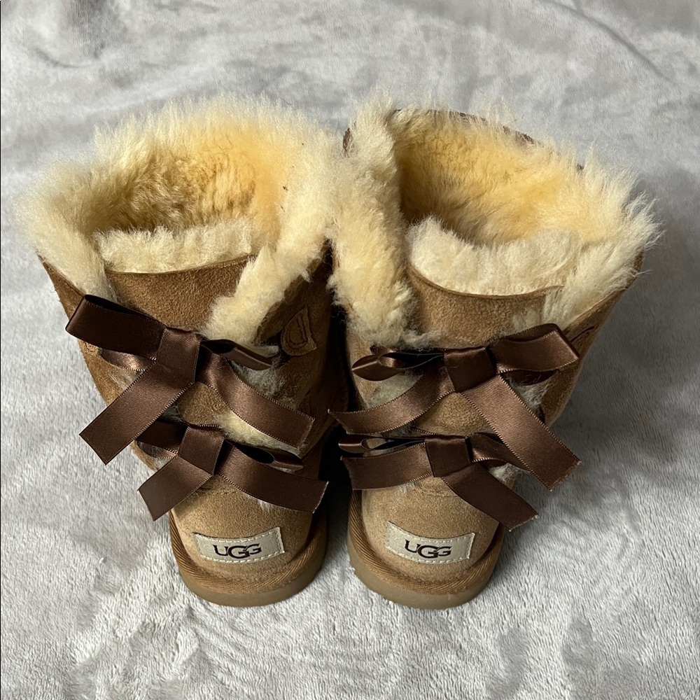 UGG Kids Tan Shearling Boots with Brown Bows